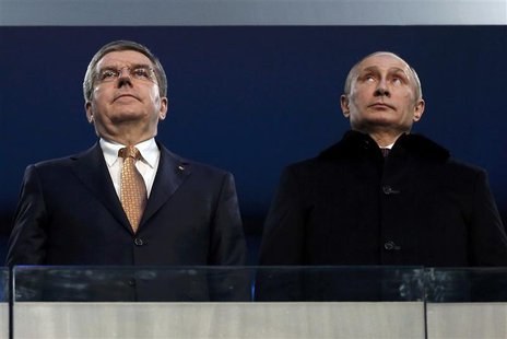 International Olympic Committee (IOC) President Thomas Bach of Germany and Russian President Vladimir Putin (R) stand together during the op International Olympic Committee (IOC) President Thomas Bach of Germany and Russian President Vladimir Putin (R) stand together during the op