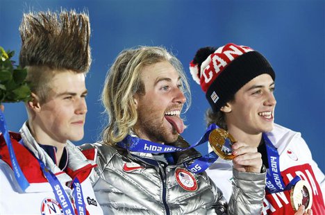 Gold medalist Sage Kotsenburg of the U.S., silver medalist Staale Sandbech (L) of Norway and bronze medalist Mark McMorris (R) of Canada rea Gold medalist Sage Kotsenburg of the U.S., silver medalist Staale Sandbech (L) of Norway and bronze medalist Mark McMorris (R) of Canada rea