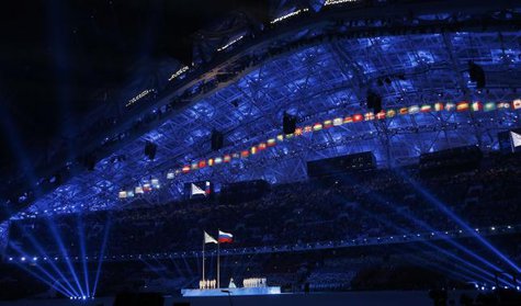 The Olympic flag and Russian national flag (C) are raised during the opening ceremony of the 2014 Sochi Winter Olympics, February 7, 2014.
CREDIT: REUTERS/JIM YOUNG The Olympic flag and Russian national flag (C) are raised during the opening ceremony of the 2014 Sochi Winter Olympics, February 7, 2014.
CREDIT: REUTERS/JIM YOUNG