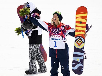 Third placed Britain's Jenny Jones gestures during flower ceremony after competing in the women's snowboard slopestyle finals event at the 2 Third placed Britain's Jenny Jones gestures during flower ceremony after competing in the women's snowboard slopestyle finals event at the 2
