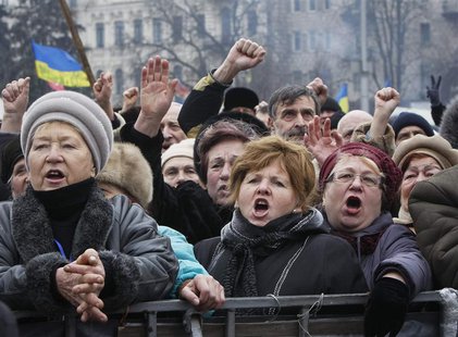 People shout slogans during an anti-government rally in Kiev February 9, 2014. REUTERS/Gleb Garanich People shout slogans during an anti-government rally in Kiev February 9, 2014. REUTERS/Gleb Garanich