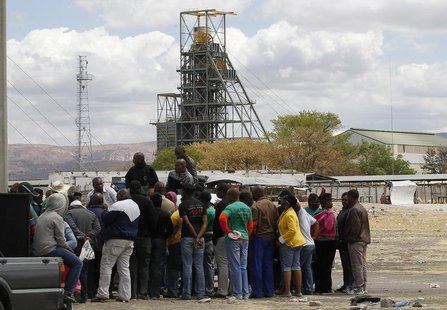Miners gather near the Anglo American Platinum's Thembelani mine near the mining town of Rustenburg, northwest of Johannesburg September 30, Miners gather near the Anglo American Platinum's Thembelani mine near the mining town of Rustenburg, northwest of Johannesburg September 30,