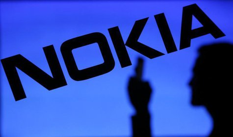 A photo illustration of a man silhouetted against a Nokia logo in the central Bosnian town of Zenica January 23, 2014. REUTERS/Dado Ruvic A photo illustration of a man silhouetted against a Nokia logo in the central Bosnian town of Zenica January 23, 2014. REUTERS/Dado Ruvic