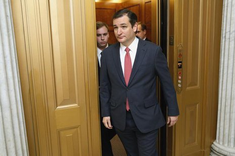 U.S. Senator Ted Cruz (R-TX) walks to the Senate floor for a vote on a $1.1 trillion U.S. spending bill at the U.S. Capitol in Washington, J U.S. Senator Ted Cruz (R-TX) walks to the Senate floor for a vote on a $1.1 trillion U.S. spending bill at the U.S. Capitol in Washington, J