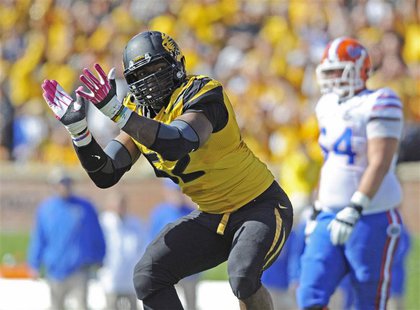 Missouri Tigers defensive lineman Michael Sam (52) celebrates after sacking Florida Gators quarterback Tyler Murphy (not pictured) during th Missouri Tigers defensive lineman Michael Sam (52) celebrates after sacking Florida Gators quarterback Tyler Murphy (not pictured) during th