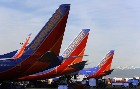 Southwest Airlines jets wait on the tarmac at Denver International Airport in Denver January 22, 2014. REUTERS/Rick Wilking Southwest Airlines jets wait on the tarmac at Denver International Airport in Denver January 22, 2014. REUTERS/Rick Wilking