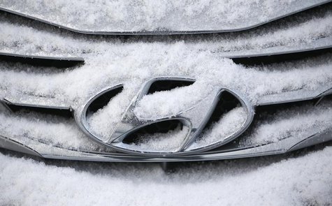 The logo of Hyundai Motor on a sedan is covered with snow at a shipping yard of South Korea's biggest automakers Hyundai Motor Co and affili The logo of Hyundai Motor on a sedan is covered with snow at a shipping yard of South Korea's biggest automakers Hyundai Motor Co and affili