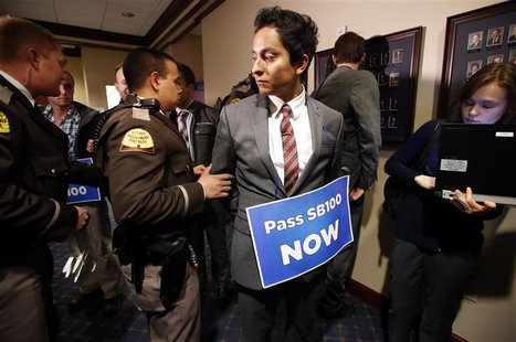 LGBT rights activist are detained by members of the Utah Highway Patrol after blocking a Senate committee hearing room at the Utah State Cap LGBT rights activist are detained by members of the Utah Highway Patrol after blocking a Senate committee hearing room at the Utah State Cap
