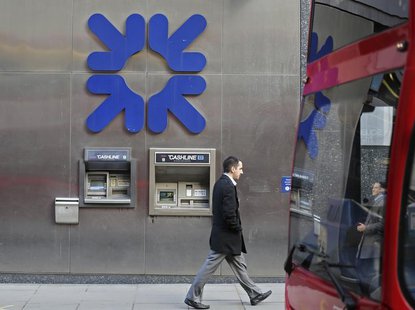 A man walks past a Royal Bank of Scotland building in central London January 28, 2014. REUTERS/Paul Hackett A man walks past a Royal Bank of Scotland building in central London January 28, 2014. REUTERS/Paul Hackett