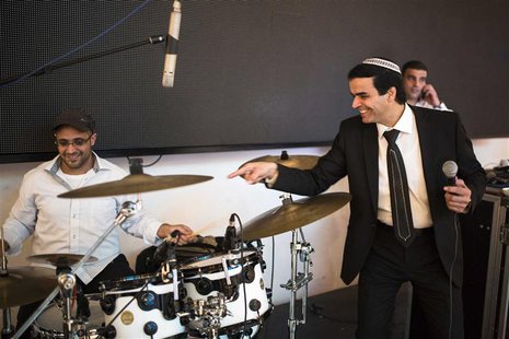 Israeli singer Zion Golan (R) performs at a wedding celebration in the southern town of Netivot February 10, 2014. REUTERS/Amir Cohen Israeli singer Zion Golan (R) performs at a wedding celebration in the southern town of Netivot February 10, 2014. REUTERS/Amir Cohen