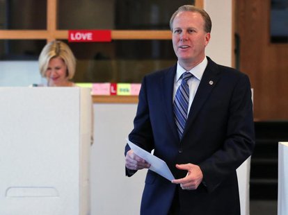San Diego mayoral candidate Kevin Faulconer votes at a polling station with wife Katherine (L) during a special election for mayor in San Di San Diego mayoral candidate Kevin Faulconer votes at a polling station with wife Katherine (L) during a special election for mayor in San Di