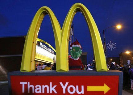 A protestor dressed up as the fictional character the "Grinch" demonstrates outside a McDonald's restaurant in Chicago, Illinois, December 5 A protestor dressed up as the fictional character the "Grinch" demonstrates outside a McDonald's restaurant in Chicago, Illinois, December 5