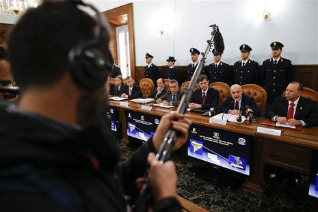 Director of the Italian S.C.O. (Central Operative System) Raffaele Grassi (2nd R) talks during a news conference with Italian and U.S. inves Director of the Italian S.C.O. (Central Operative System) Raffaele Grassi (2nd R) talks during a news conference with Italian and U.S. inves
