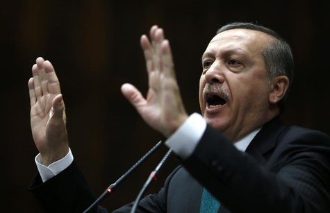 Turkey's Prime Minister Tayyip Erdogan addresses members of the parliament from his ruling AK Party (AKP) during a meeting at the Turkish pa Turkey's Prime Minister Tayyip Erdogan addresses members of the parliament from his ruling AK Party (AKP) during a meeting at the Turkish pa