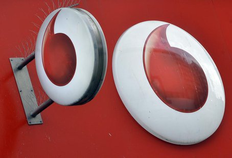 Vodafone branding is seen outside a retail store in London November 12, 2013. REUTERS/Toby Melville Vodafone branding is seen outside a retail store in London November 12, 2013. REUTERS/Toby Melville