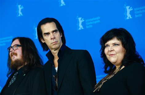 Directors Ian Forsyth (L) and Jane Pollard (R) pose with cast member Nick Cave during a photocall promoting the movie "20,000 Days on Earth" Directors Ian Forsyth (L) and Jane Pollard (R) pose with cast member Nick Cave during a photocall promoting the movie "20,000 Days on Earth"