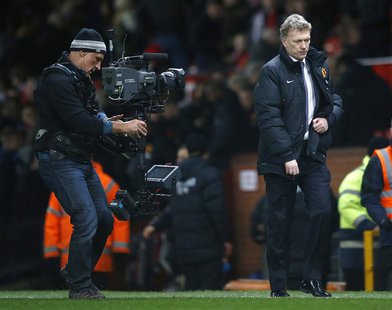 Manchester United manager David Moyes walks back to the dressing rooms after their English Premier League soccer match against Fulham at Old Manchester United manager David Moyes walks back to the dressing rooms after their English Premier League soccer match against Fulham at Old
