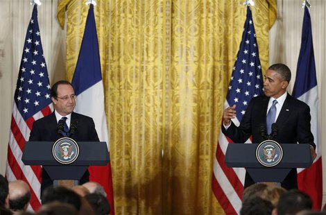U.S. President Barack Obama (R) and French President Francois Hollande address a joint news conference in the East Room of the White House i U.S. President Barack Obama (R) and French President Francois Hollande address a joint news conference in the East Room of the White House i