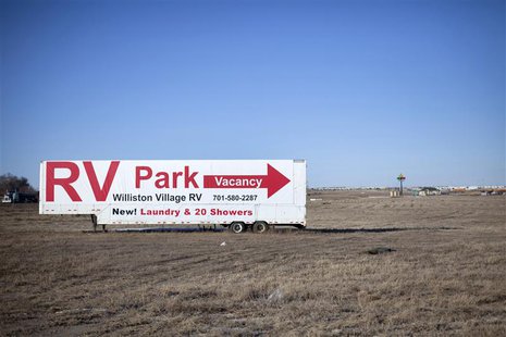 Signs are shown pointing to a Recreational Vehicle park outside of Williston, North Dakota February 9, 2014. REUTERS/Annie Flanagan Signs are shown pointing to a Recreational Vehicle park outside of Williston, North Dakota February 9, 2014. REUTERS/Annie Flanagan