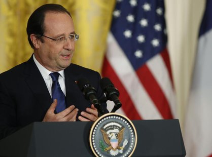 French President Francois Hollande addresses a joint news conference with U.S. President Barack Obama in the East Room of the White House in French President Francois Hollande addresses a joint news conference with U.S. President Barack Obama in the East Room of the White House in