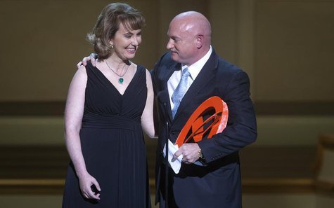Gabrielle Giffords is hugged by her husband Mark Kelly during the Glamour Magazine Women of the Year event in New York, November 11, 2013. R Gabrielle Giffords is hugged by her husband Mark Kelly during the Glamour Magazine Women of the Year event in New York, November 11, 2013. R