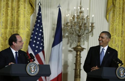 U.S. President Barack Obama (R) and French President Francois Hollande address a joint news conference in the East Room of the White House i U.S. President Barack Obama (R) and French President Francois Hollande address a joint news conference in the East Room of the White House i