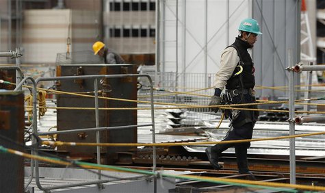 Men work at a construction site in Tokyo February 12, 2014. REUTERS/Yuya Shino Men work at a construction site in Tokyo February 12, 2014. REUTERS/Yuya Shino