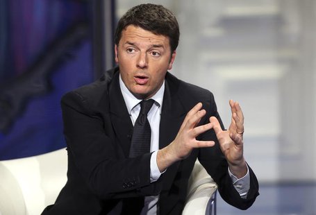 Italy's center-left Democratic Party (PD) leader Matteo Renzi gestures as he appears as a guest on the RAI television show Porta a Porta (Do Italy's center-left Democratic Party (PD) leader Matteo Renzi gestures as he appears as a guest on the RAI television show Porta a Porta (Do