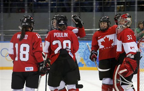 Canada's Catherine Ward, Marie-Philip Poulin, Jocelyne Larocque and goalie Charline Labonte celebrate after defeating Team USA in their wome Canada's Catherine Ward, Marie-Philip Poulin, Jocelyne Larocque and goalie Charline Labonte celebrate after defeating Team USA in their wome