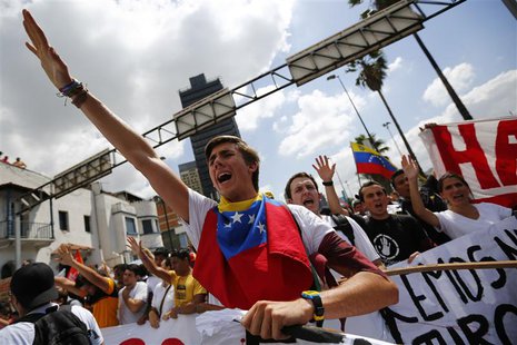 Opposition supporters demonstrate against Venezuela's President Nicolas Maduro's government in Caracas February 12, 2014. REUTERS/Jorge Silv Opposition supporters demonstrate against Venezuela's President Nicolas Maduro's government in Caracas February 12, 2014. REUTERS/Jorge Silv