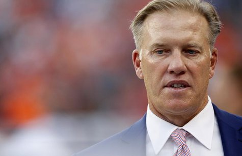 Denver Broncos Executive Vice President of Football Operations John Elway walks on the field before their NFL football game against the Balt Denver Broncos Executive Vice President of Football Operations John Elway walks on the field before their NFL football game against the Balt