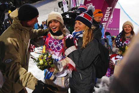 Gold medalist Kaitlyn Farrington (C) of the U.S. celebrates with her parents Gary and Suze Farrington after winning the women's snowboard ha Gold medalist Kaitlyn Farrington (C) of the U.S. celebrates with her parents Gary and Suze Farrington after winning the women's snowboard ha