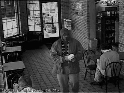 The suspect is scene in surveillance footage. The suspect is scene in surveillance footage.