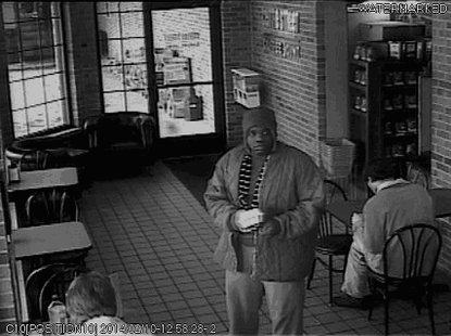 The suspect is scene in surveillance footage. The suspect is scene in surveillance footage.