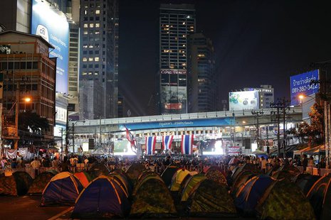 Anti-government protesters camp near a stage as they occupy a main intersection in central Bangkok February 5, 2014. REUTERS/Athit Perawongm Anti-government protesters camp near a stage as they occupy a main intersection in central Bangkok February 5, 2014. REUTERS/Athit Perawongm