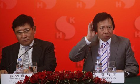 Chairmen of Hong Kong developer Sun Hung Kai Properties Raymond Kwok (L) and Thomas Kwok listen to questions during a news conference in Hon Chairmen of Hong Kong developer Sun Hung Kai Properties Raymond Kwok (L) and Thomas Kwok listen to questions during a news conference in Hon