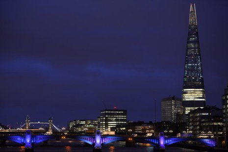 The Shard Building skyscraper (R) is seen with Tower Bridge (L) at dusk in London December 18, 2013. REUTERS/Toby Melville The Shard Building skyscraper (R) is seen with Tower Bridge (L) at dusk in London December 18, 2013. REUTERS/Toby Melville