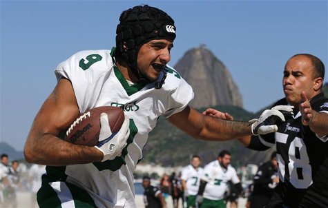 Felipe Fernandes (L) of Ipanema Tatuis is tackled by Jorge Ramos of Piratas de Copacabana during their Carioca Bowl state football league, o Felipe Fernandes (L) of Ipanema Tatuis is tackled by Jorge Ramos of Piratas de Copacabana during their Carioca Bowl state football league, o