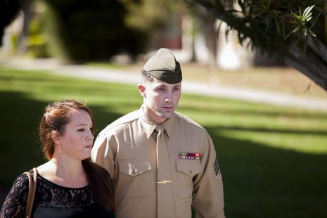 United States Marine Sergeant Lawrence Hutchins III departs from his arraignment hearing with his wife Reyna Hutchins at Camp Pendelton, Cal United States Marine Sergeant Lawrence Hutchins III departs from his arraignment hearing with his wife Reyna Hutchins at Camp Pendelton, Cal