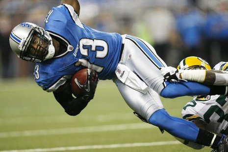 Detroit Lions wide receiver Nate Burleson is tackled by Green Bay Packers defensive back Sam Shields (R) after a pass reception in the first Detroit Lions wide receiver Nate Burleson is tackled by Green Bay Packers defensive back Sam Shields (R) after a pass reception in the first