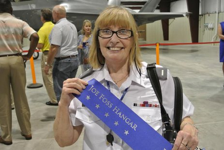 First Lieutenant Janet Watson, Historian, CAP’s Yuma Composite Squadron 508 of the Arizona Wing holds a banner dedicating hangar to Joe Foss. (Photo Courtesy C.A.P.) First Lieutenant Janet Watson, Historian, CAP’s Yuma Composite Squadron 508 of the Arizona Wing holds a banner dedicating hangar to Joe Foss. (Photo Courtesy C.A.P.)