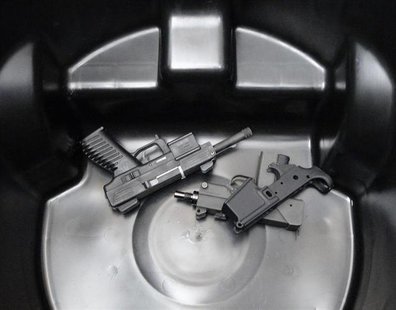 A Uzi semiautomatic rifle, with other weapons, are placed in trash bin after citizens surrendered them during a gun buyback program organize A Uzi semiautomatic rifle, with other weapons, are placed in trash bin after citizens surrendered them during a gun buyback program organize