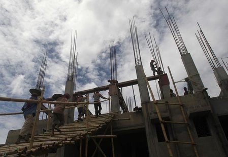 Labourers work at the construction site of a commercial complex in Agartala, capital of India's northeastern Indian state of Tripura August Labourers work at the construction site of a commercial complex in Agartala, capital of India's northeastern Indian state of Tripura August