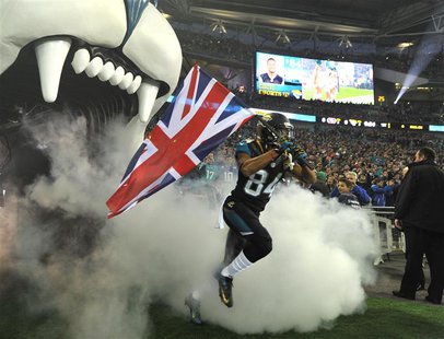 Jacksonville Jaguars wide receiver Cecil Shorts carries Britain's Union Jack as he enters the field before the Jaguars met the San Francisco Jacksonville Jaguars wide receiver Cecil Shorts carries Britain's Union Jack as he enters the field before the Jaguars met the San Francisco