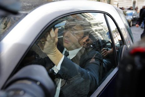 Center-left leader Matteo Renzi drives as he leaves at the end of a meeting with Italian Prime Minister Enrico Letta in Rome February 12, 20 Center-left leader Matteo Renzi drives as he leaves at the end of a meeting with Italian Prime Minister Enrico Letta in Rome February 12, 20
