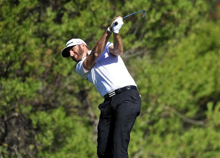 February 13, 2014; Pacific Palisades, CA, USA; Dustin Johnson hits out of the fourth hole tee during the first round at Riviera Country Club February 13, 2014; Pacific Palisades, CA, USA; Dustin Johnson hits out of the fourth hole tee during the first round at Riviera Country Club
