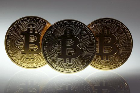 Mock Bitcoins are displayed on a table in an illustration picture taken in Berlin January 7, 2014. REUTERS/Pawel Kopczynski Mock Bitcoins are displayed on a table in an illustration picture taken in Berlin January 7, 2014. REUTERS/Pawel Kopczynski