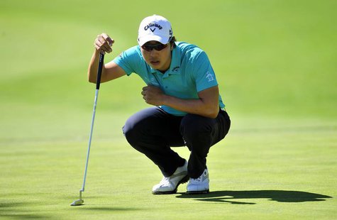 Sang-Moon Bae lines up his putt on the eighteenth hole green during the second round of the Northern Trust Open at Riviera Country Club. Man Sang-Moon Bae lines up his putt on the eighteenth hole green during the second round of the Northern Trust Open at Riviera Country Club. Man