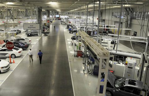 Two Volkswagen employees walk through the axle alignment department at the VW plant in Chattanooga, Tennessee in this December 1, 2011 file Two Volkswagen employees walk through the axle alignment department at the VW plant in Chattanooga, Tennessee in this December 1, 2011 file