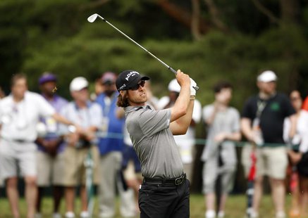 Australia's Aaron Baddeley watches his shot on the first fairway during a practice round for the 2013 U.S. Open golf championship at the Mer Australia's Aaron Baddeley watches his shot on the first fairway during a practice round for the 2013 U.S. Open golf championship at the Mer